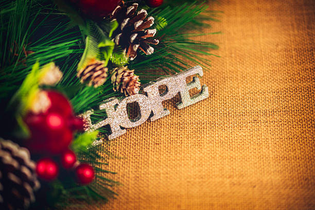Christmas border of pine branches with message of Hope