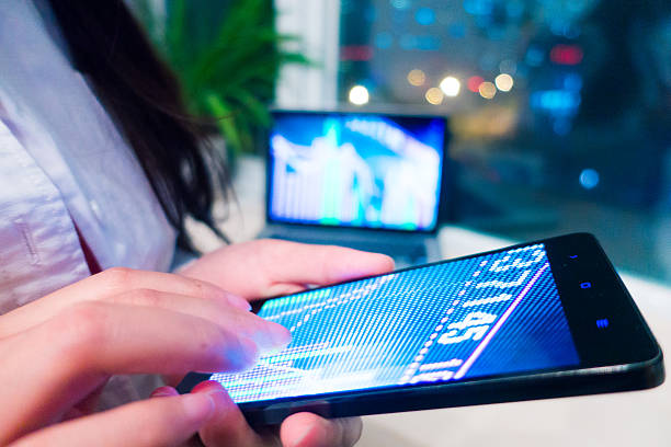 istock Smartphone and laptop with stock market graph 520294070