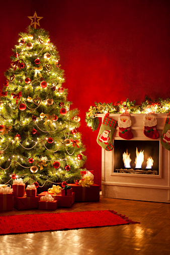Christmas Tree with presents near fireplace