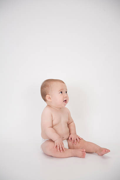 istock cute baby girl looking to side 520295717