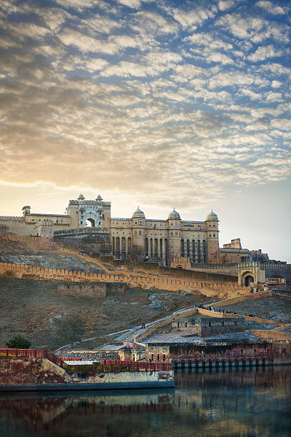 Amer Palace at sunset in Amer, India Amer Palace/Amer Fort at sunset in Amer, Jaipur, Rajasthan, India. (sometimes spelled and pronounced Amber). jaipur stock pictures, royalty-free photos & images