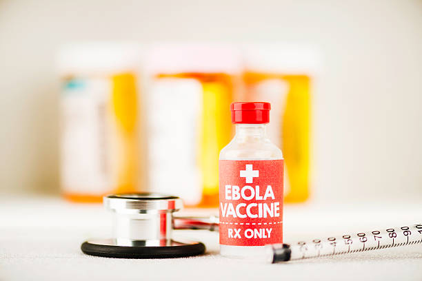 istock Ebola vaccine with syringe and pill bottles 520295805