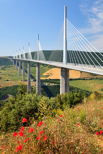 Millau, France - June 12, 2014: Morning shot of Millau Viaduct, a cable-stayed bridge that spans the valley of the River Tarn near Millau in southern France.