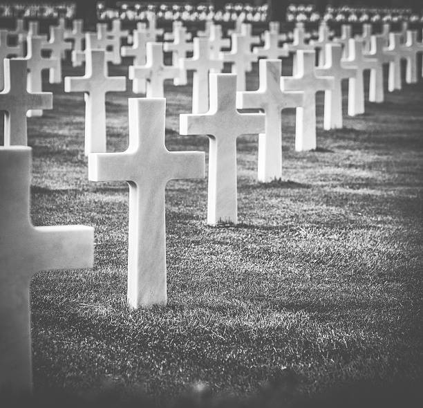 istock White graveyard cross in monochrome 520296303