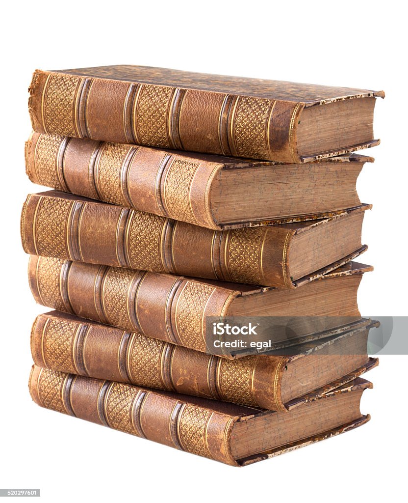 Pile of ancient books Pile of ancient books isolated on a white background Ancient Stock Photo