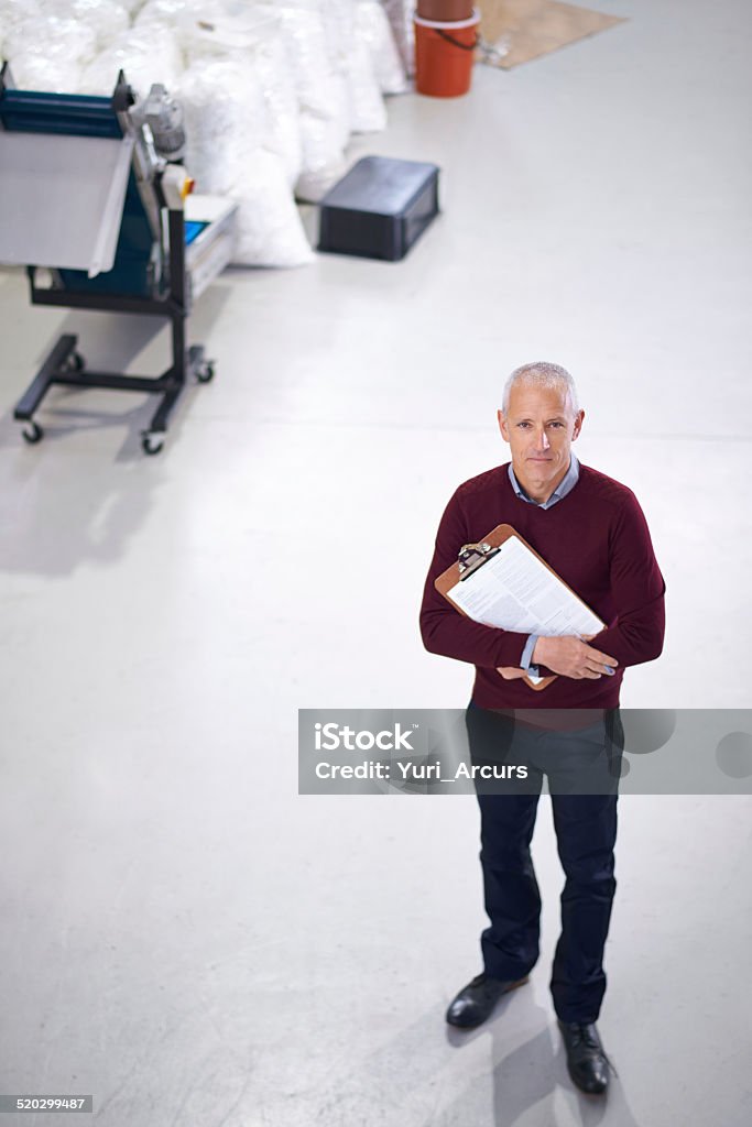 I'm in charge of this operation Portrait of a factory manager standing with a clipboard during an inspection 40-49 Years Stock Photo