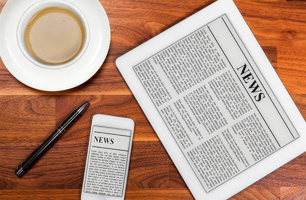 Digital Tablet PC With News On Desk