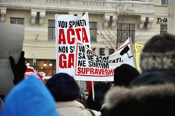 Citizens protesting against Romanian Government Cluj Napoca, Romania - February 11, 2012: Hundreds of people protesting against Acta, against web piracy treaty, and the government in Cluj Napoca ostentation stock pictures, royalty-free photos & images