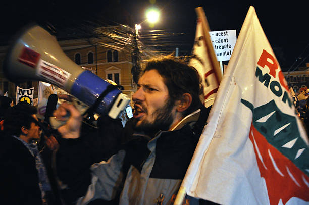 Civil unrest against Government Cluj Napoca, Romania - February 11, 2012: Hundreds of people protesting against Acta, against web piracy treaty, and the government in Cluj Napoca ostentation stock pictures, royalty-free photos & images