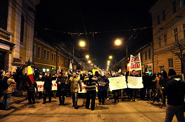 Riot against Government Cluj Napoca, Romania - February 11, 2012: Hundreds of people protesting against Acta, against web piracy treaty, and the government in Cluj Napoca ostentation stock pictures, royalty-free photos & images