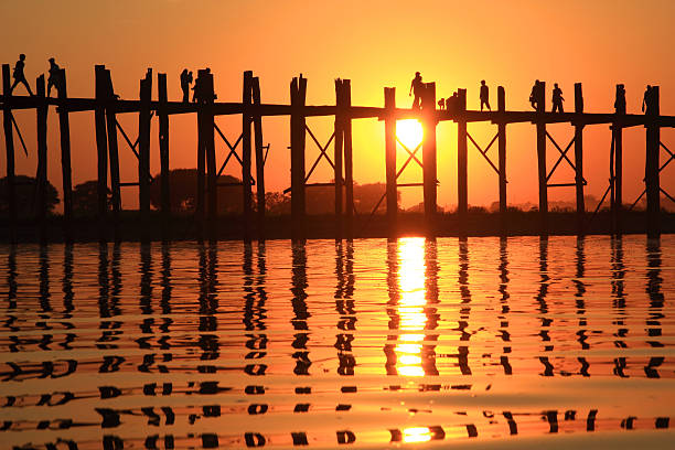 istock Silhouette of U bein bridge at sunset 520322917