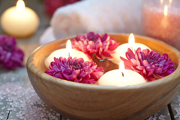 istock Spa theme with candles and flowers 520322988