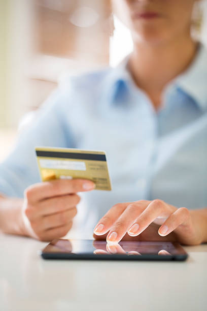 istock Woman is shopping online with tablet pc 520323285