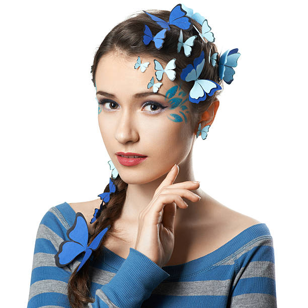 istock girl with art make-up blue butterflies 520323545