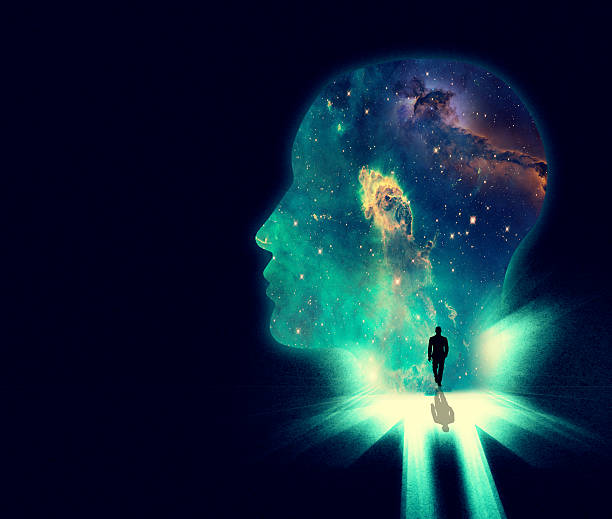 Open your mind the the wonders of the universe Illustration of a man walking towards a huge shape of a person's head overlaid with an image of the cosmos human brain stock illustrations