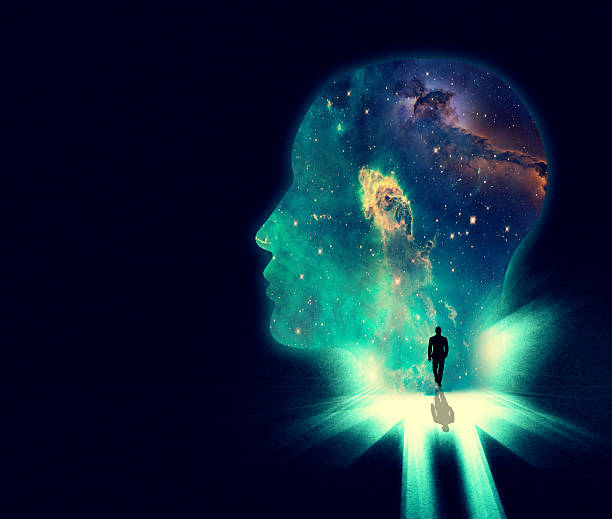 Open your mind the the wonders of the universe Illustration of a man walking towards a huge shape of a person's head overlaid with an image of the cosmos creative background stock illustrations