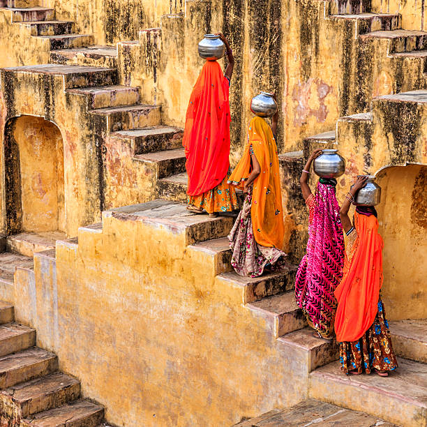 istock Indian women carrying water from stepwell, Rajasthan 520324782