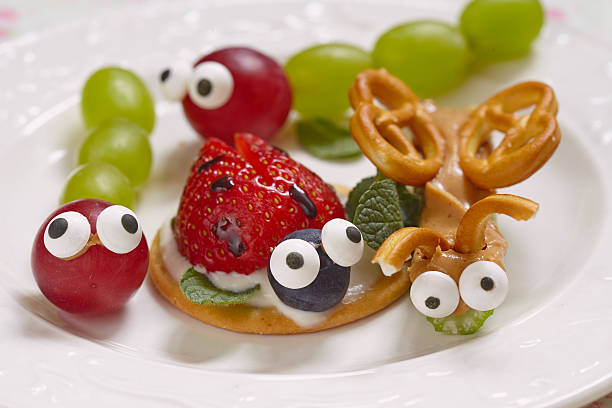 istock Funny beetles from grapes and berries 520325160