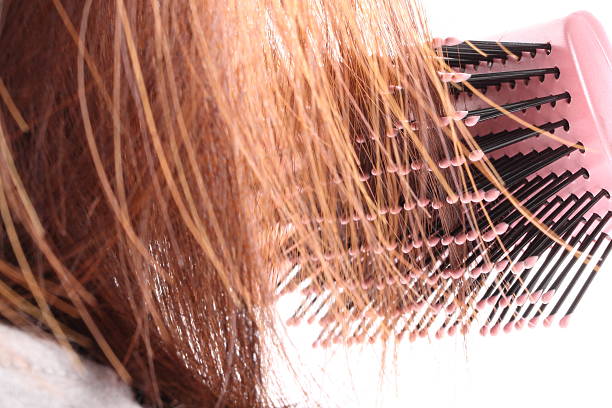 istock Woman Brushing Her Hair 520325405