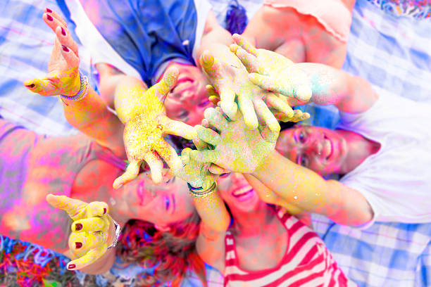 istock lying group of young adult pushes his hands up 520325630