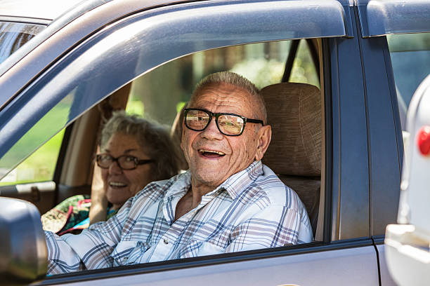 istock Senior Couple Laughing In Car 520325663