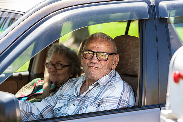 istock Senior Couple Funny Faces In Car 520325669