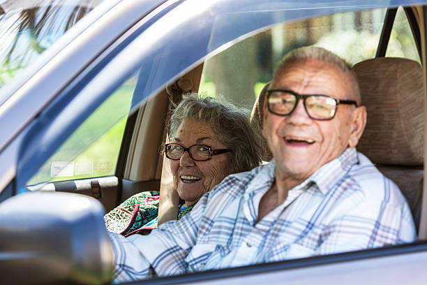 istock Senior Couple Grinning In Car 520325739