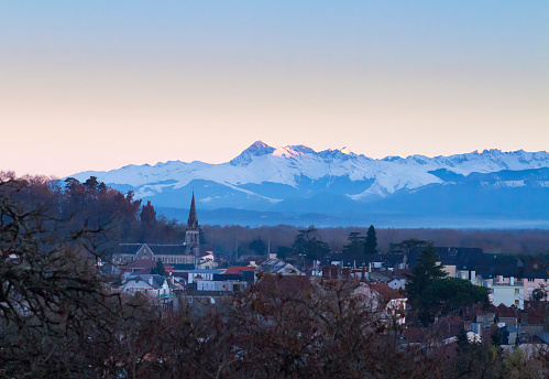 This image of the Pyrennes was shot at sunset. The old part of the city of Pau, one of the largest cities in the Pyrennes-Atalantic province of Acquitaine, is in the foreground. This lovely city is the birthplace of King Henry the 4th of France and Navarre and the founder of the Bourbon dynasty which rule France for many years. Pau is a gateway to the Pyrennes mountains which separate France and Spain.