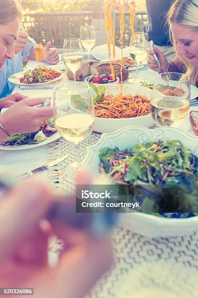 Group Of Friends Having A Meal Outdoors Stock Photo - Download Image Now - Friendship, Restaurant, Australia