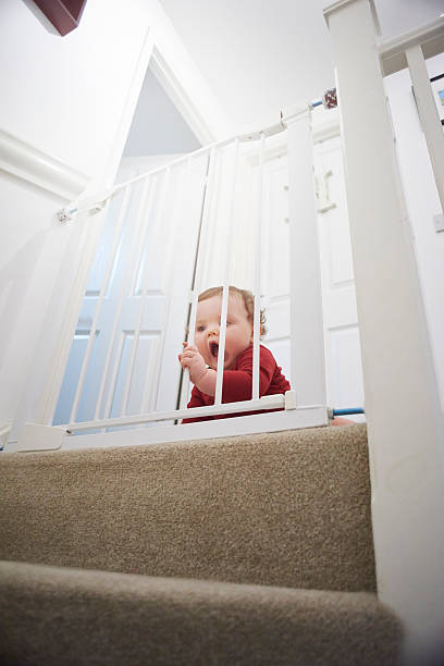 istock Baby safety gate on stairs 520328996