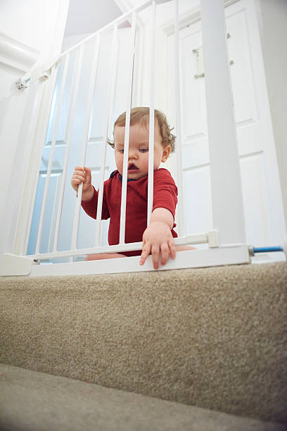 istock Baby safety gate on stairs 520329380