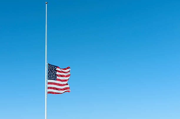 istock United States Flag flying halfstaff 520330042