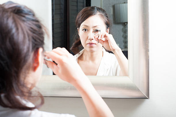istock Women who have a makeup look in the mirror 520330640