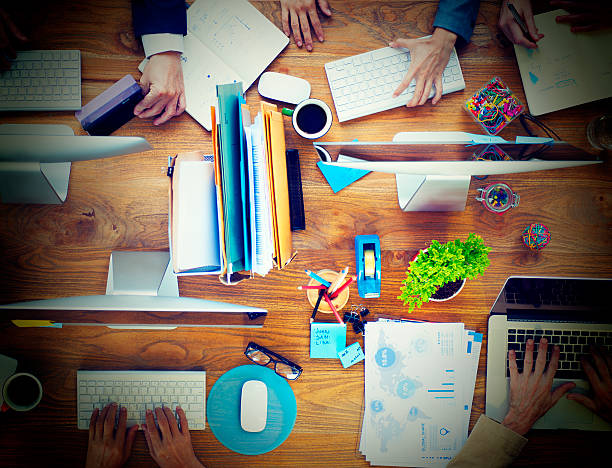 istock Group of Business People Working on an Office Desk Concept 520332870
