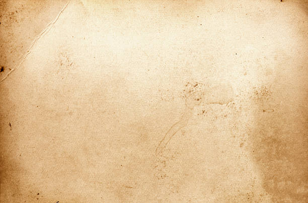 istock Old dirty paper background with crumpled corner. 520335968