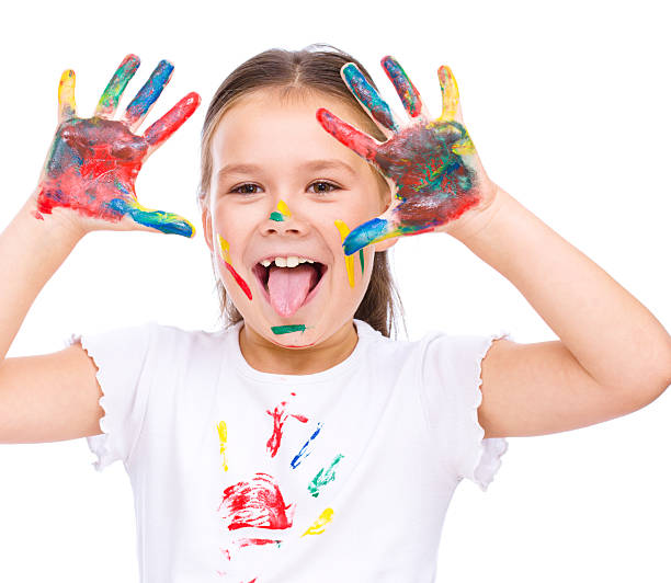 istock Cute girl playing with paints 520359689