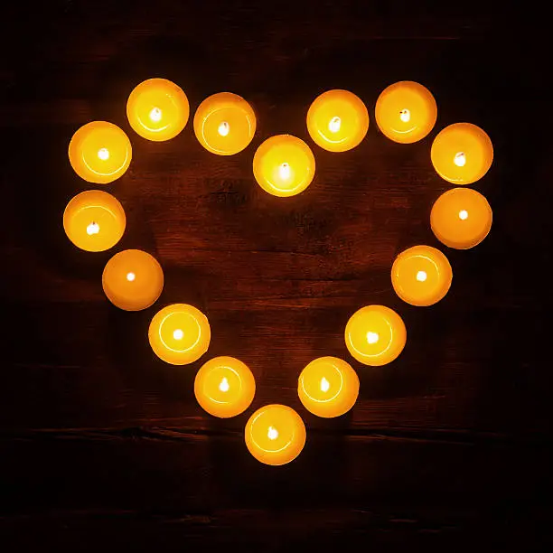 tealights in a heart shape seen in a top view