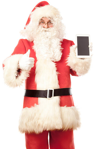 istock Santa Claus showing digital tablet, giving thumbs up 520361633