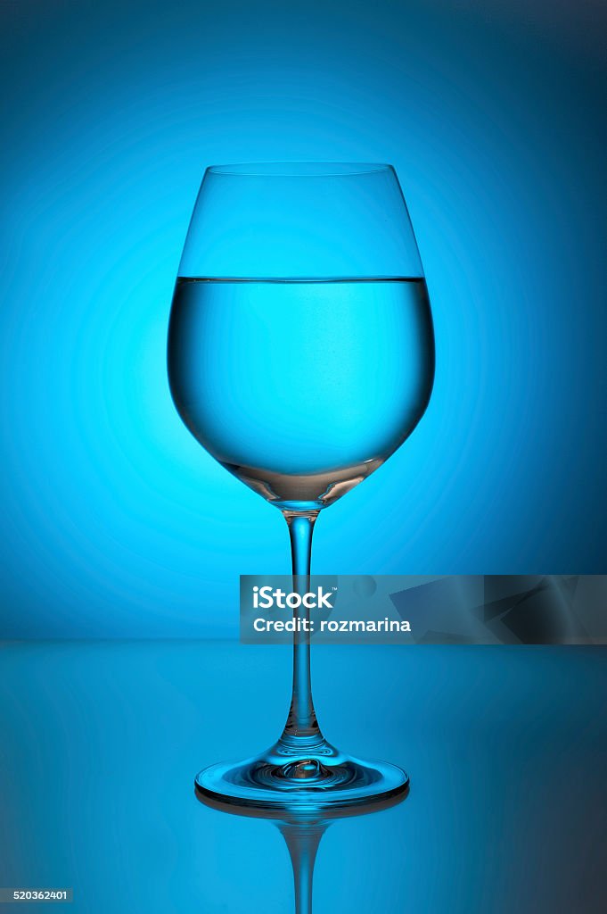 Glass with water on a blue background Cold Drink Stock Photo