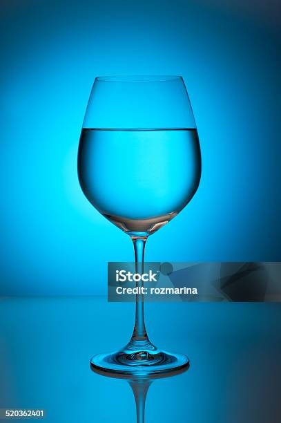 Glass With Water On A Blue Background Stock Photo - Download Image Now - Cold Drink, Crockery, Drink