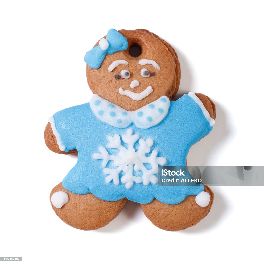 Gingerbread man. Girl bow in blue coat with snowflake Gingerbread man. in a blue coat and scarf isolated on white background Adult Stock Photo