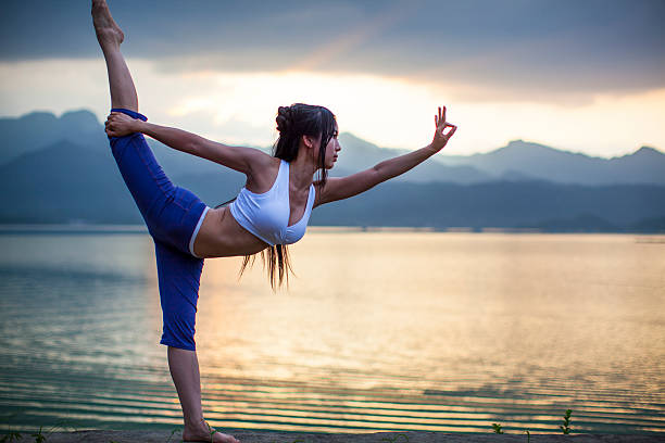 istock Young woman practicing yoga 520362577