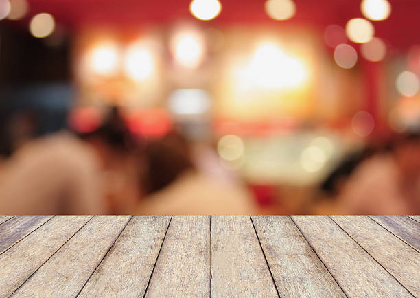 istock Perspective wood with blurred cafe bokeh light background 520364374