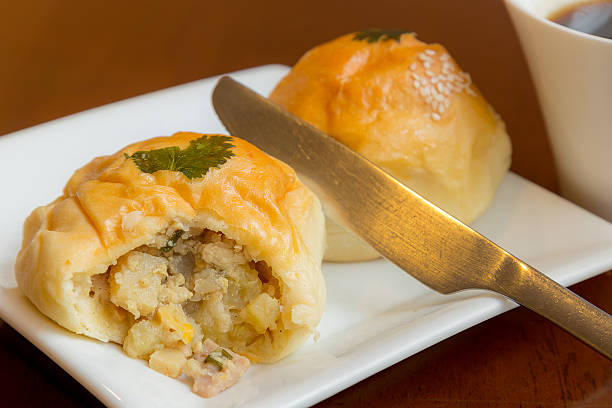 istock Chicken and mushroom breads on table with cup of coffee 520365211