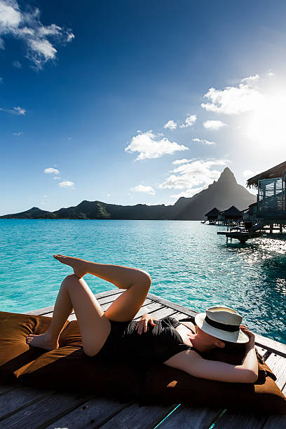 istock Young Woman Sunbathing in Bora Bora 520365291