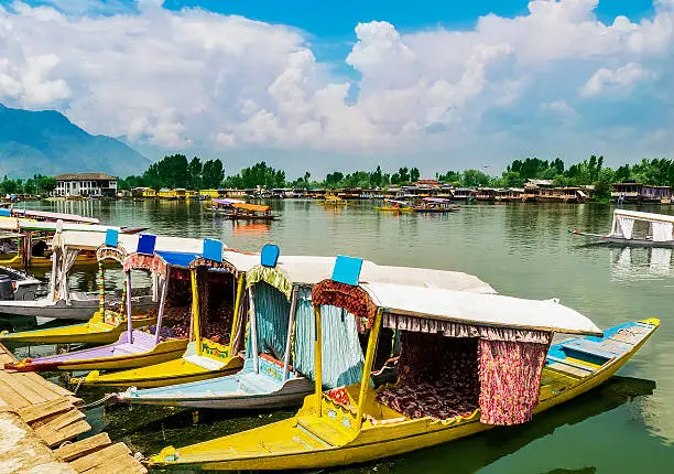 Shikara boats / Lifestyle in Dal Lake. Local people use Shilara (a small boat) for transportation in Dal Lake. It is the most attractive destination for tourists visiting Srinagar, Kashmir, India.