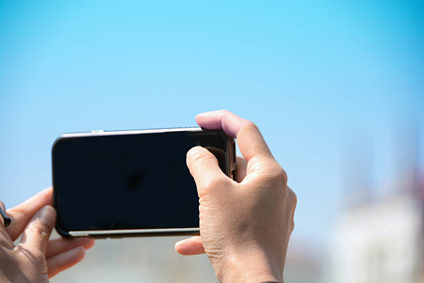 istock Taking a photo with a cell, mobile, phone-  copy space 520366216