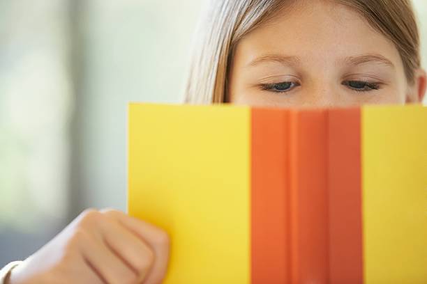 Young girl engrossed in a book