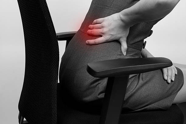 istock Young businesswoman having back pain 520366456