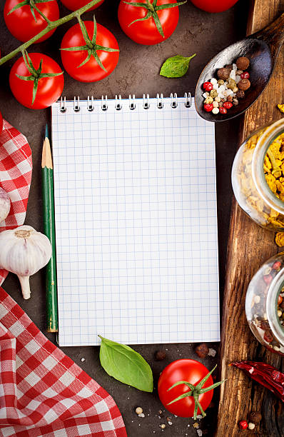 istock Blank recipe book on a table with vegetables 520366486